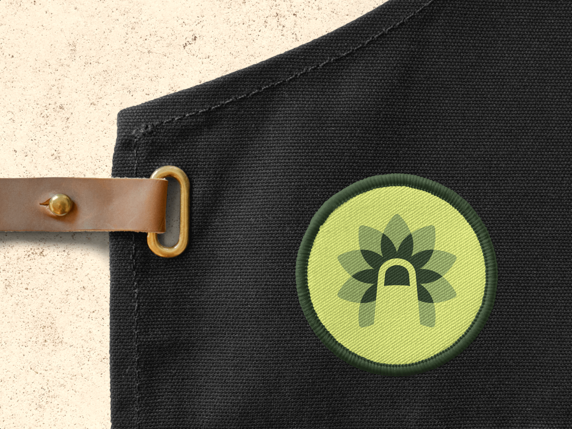 The Wild Thumb logo on an apron